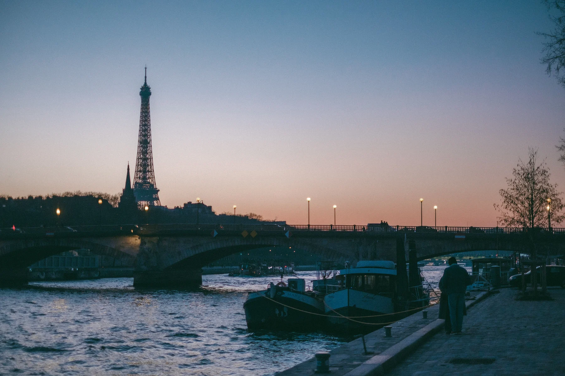 Paris — the Eiffel Tower and riverside promenade in the evening