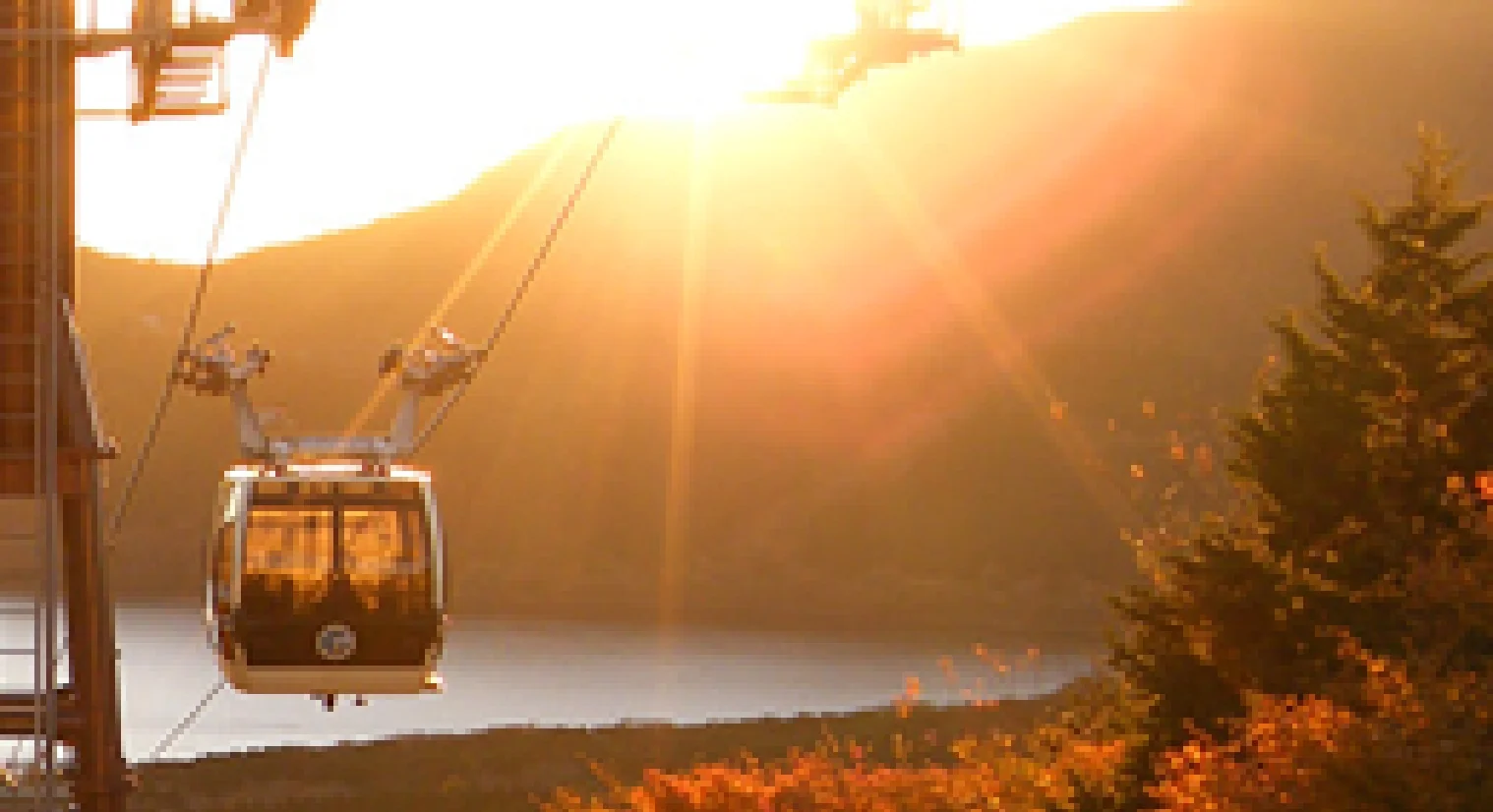 Hakone — ropeway gondola above Lake Ashi in golden evening light