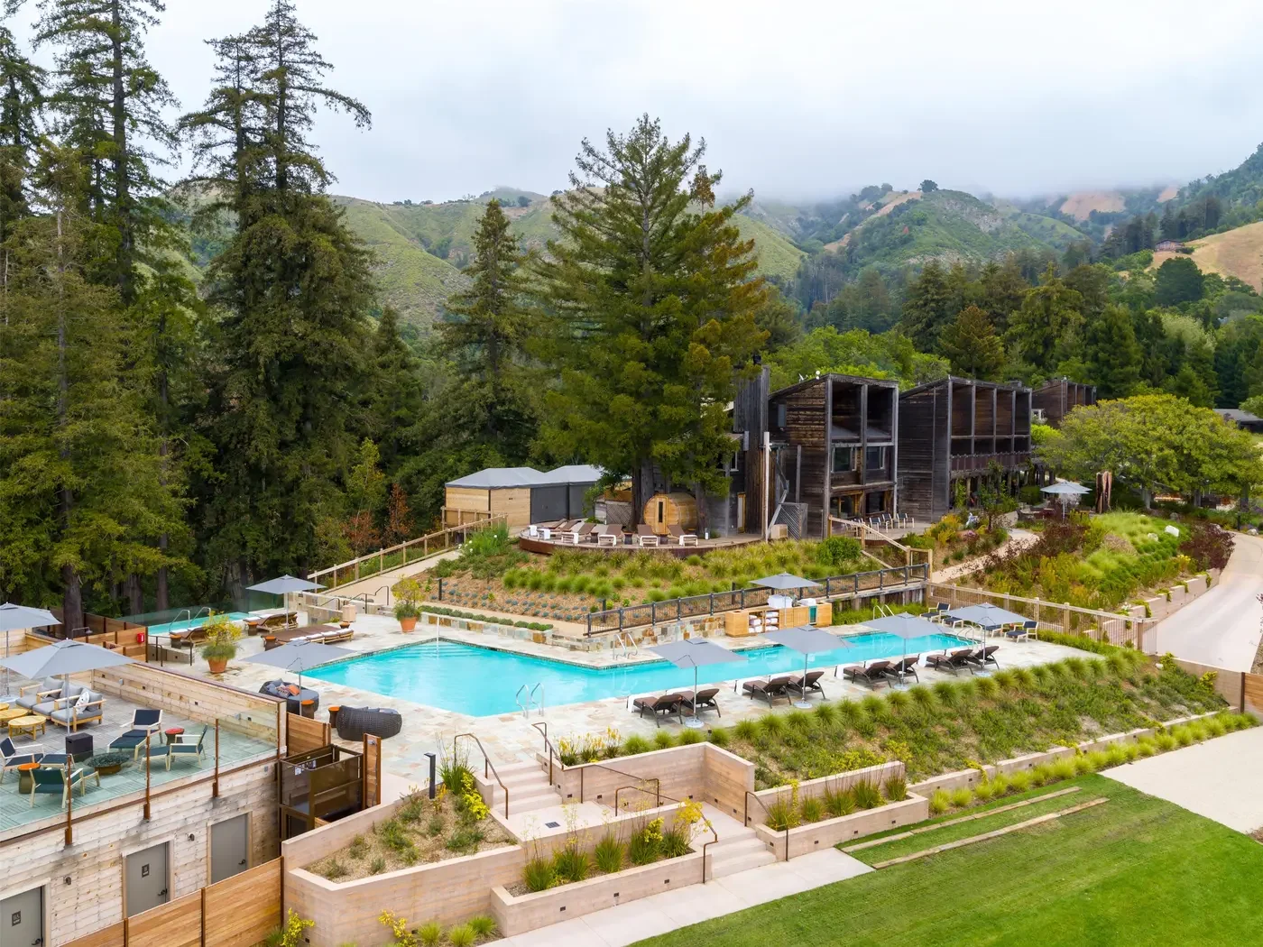 Alila Ventana Big Sur — Alila Ventana Big Sur pool, resort buildings and forested hills