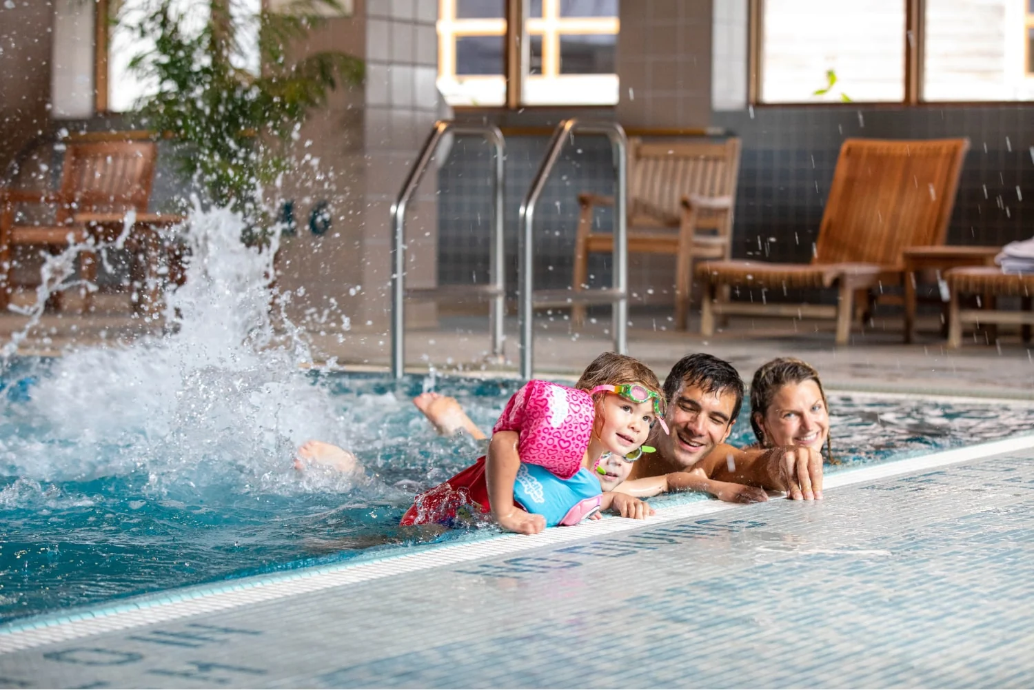 Alyeska Resort — A family enjoying Alyeska Resort’s indoor saltwater pool