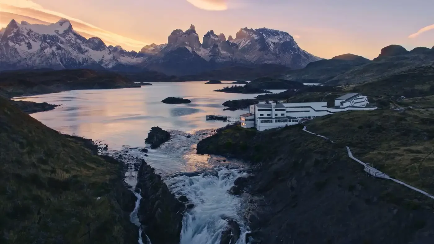 Explora Torres del Paine — Explora Torres del Paine beside Lake Pehoé and the Cuernos in evening light