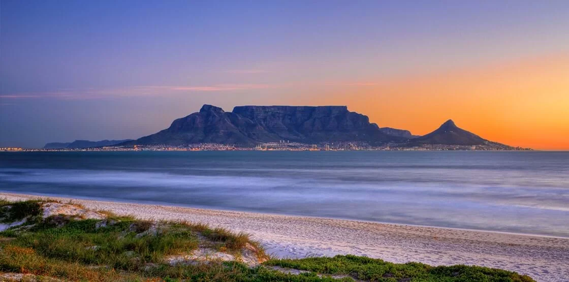 Cape Town — Table Mountain above the Atlantic shore at sunset