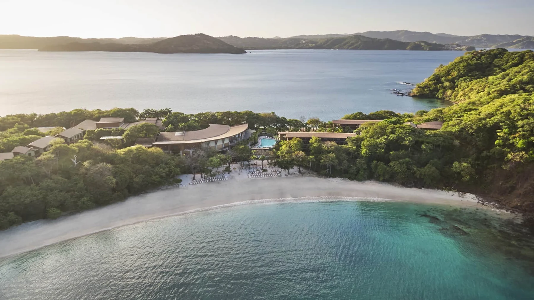 Peninsula Papagayo — sheltered bay and forested Four Seasons shoreline