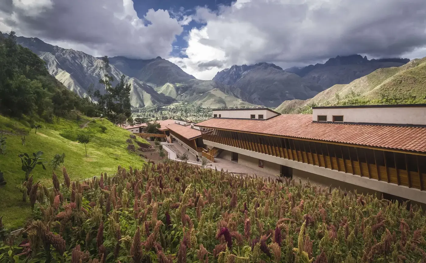 Explora Sacred Valley — Explora Valle Sagrado lodge, fields and Andean mountain setting